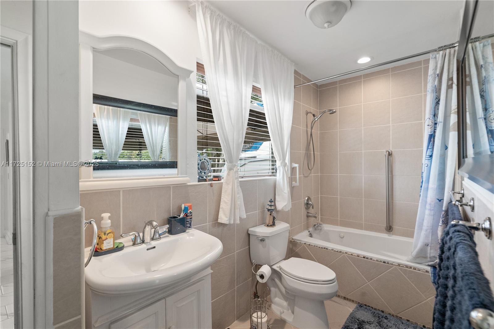 7271 Sunset Strip Sunrise, FL 33313 - Photo 30 of 45 a bathroom with a sink toilet and shower