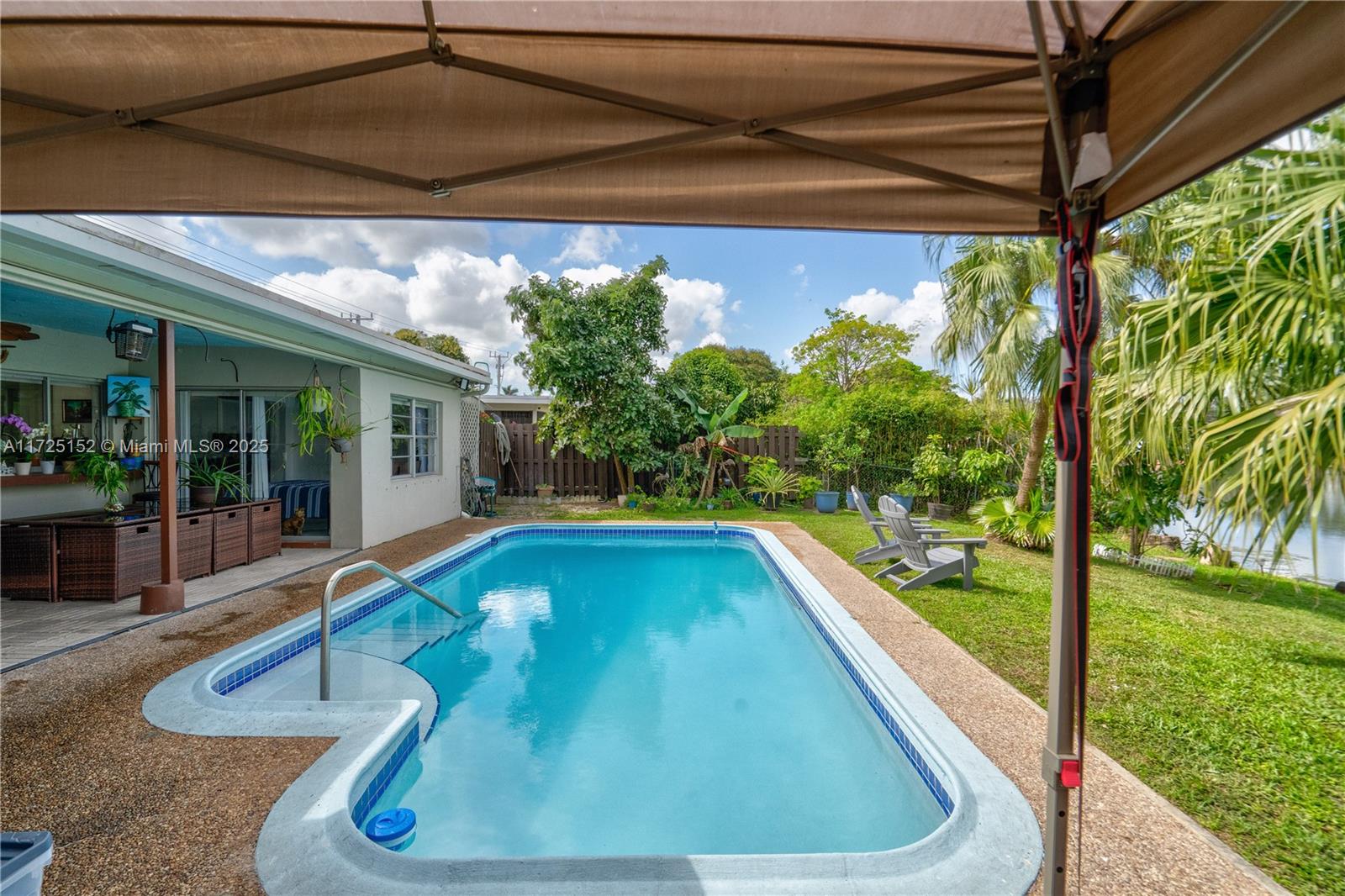 7271 Sunset Strip Sunrise, FL 33313 - Photo 38 of 45 a view of a swimming pool with a patio