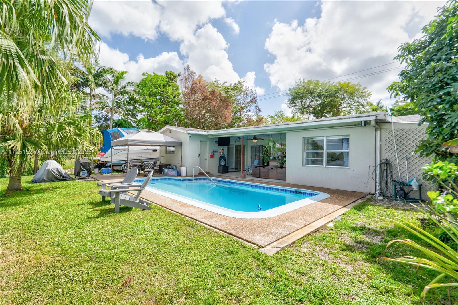 7271 Sunset Strip Sunrise, FL 33313 - Photo 39 of 45 a view of a house with swimming pool and sitting area