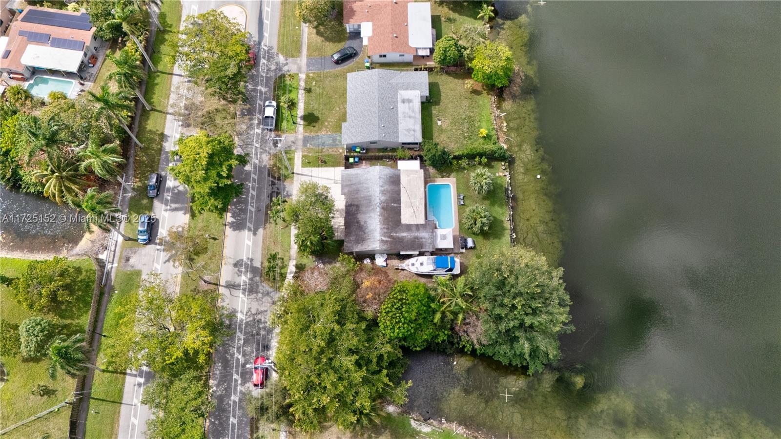 7271 Sunset Strip Sunrise, FL 33313 - Photo 5 of 45 an aerial view of a house with a yard and garden