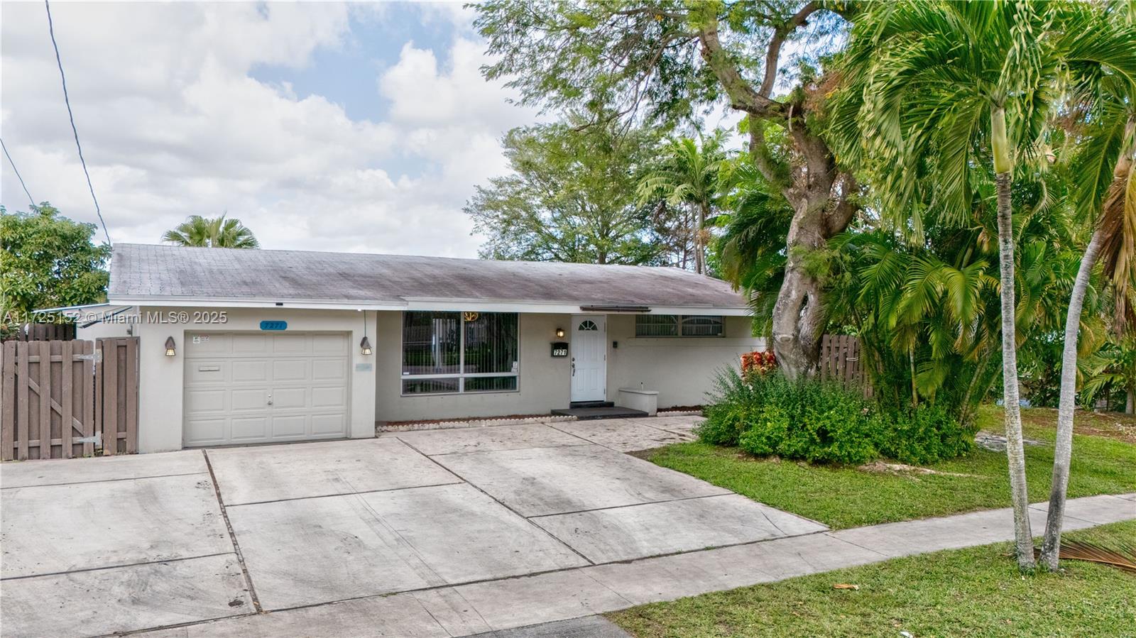 7271 Sunset Strip Sunrise, FL 33313 - Photo 7 of 45 a view of a house with a garden
