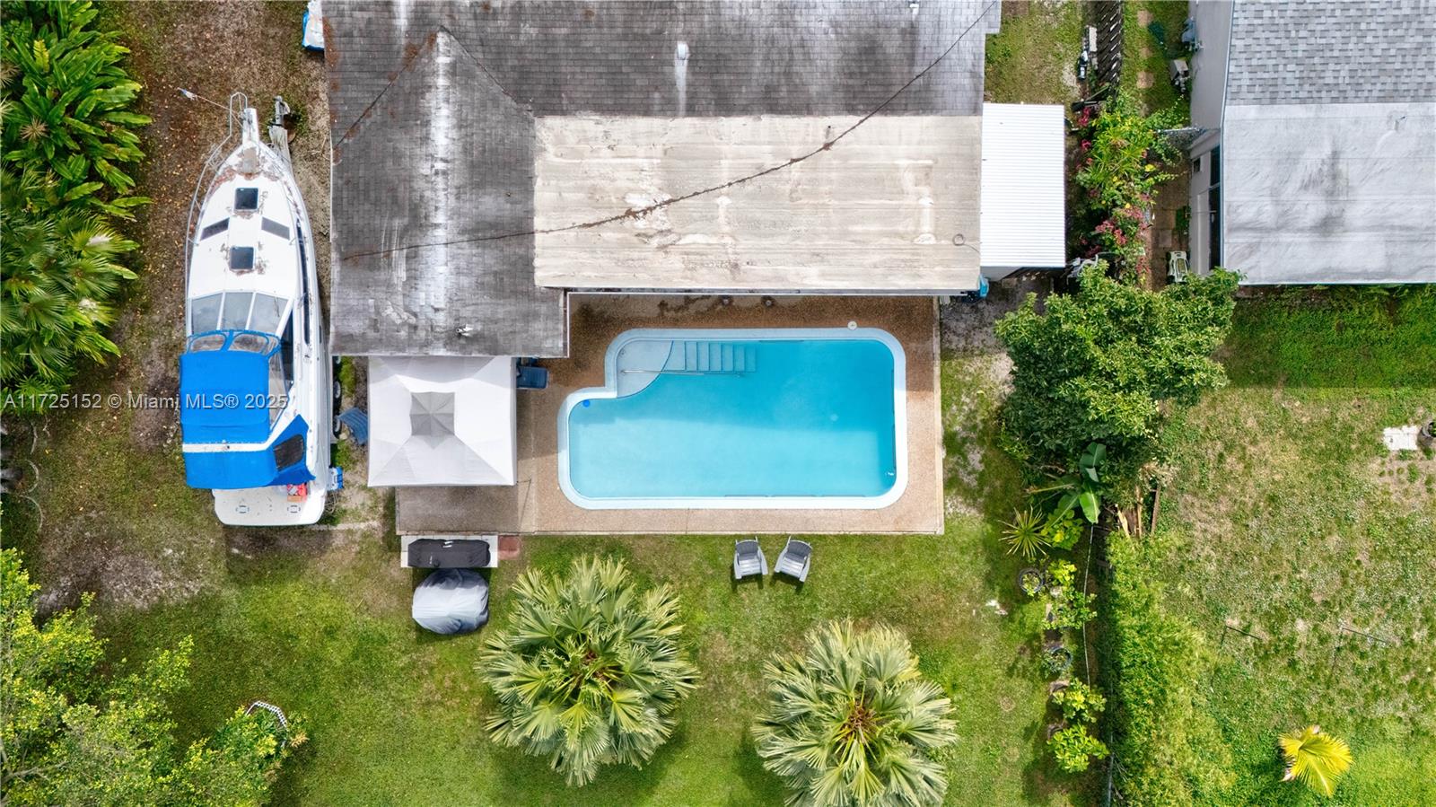 7271 Sunset Strip Sunrise, FL 33313 - Photo 10 of 45 swimming pool with some plants and large trees