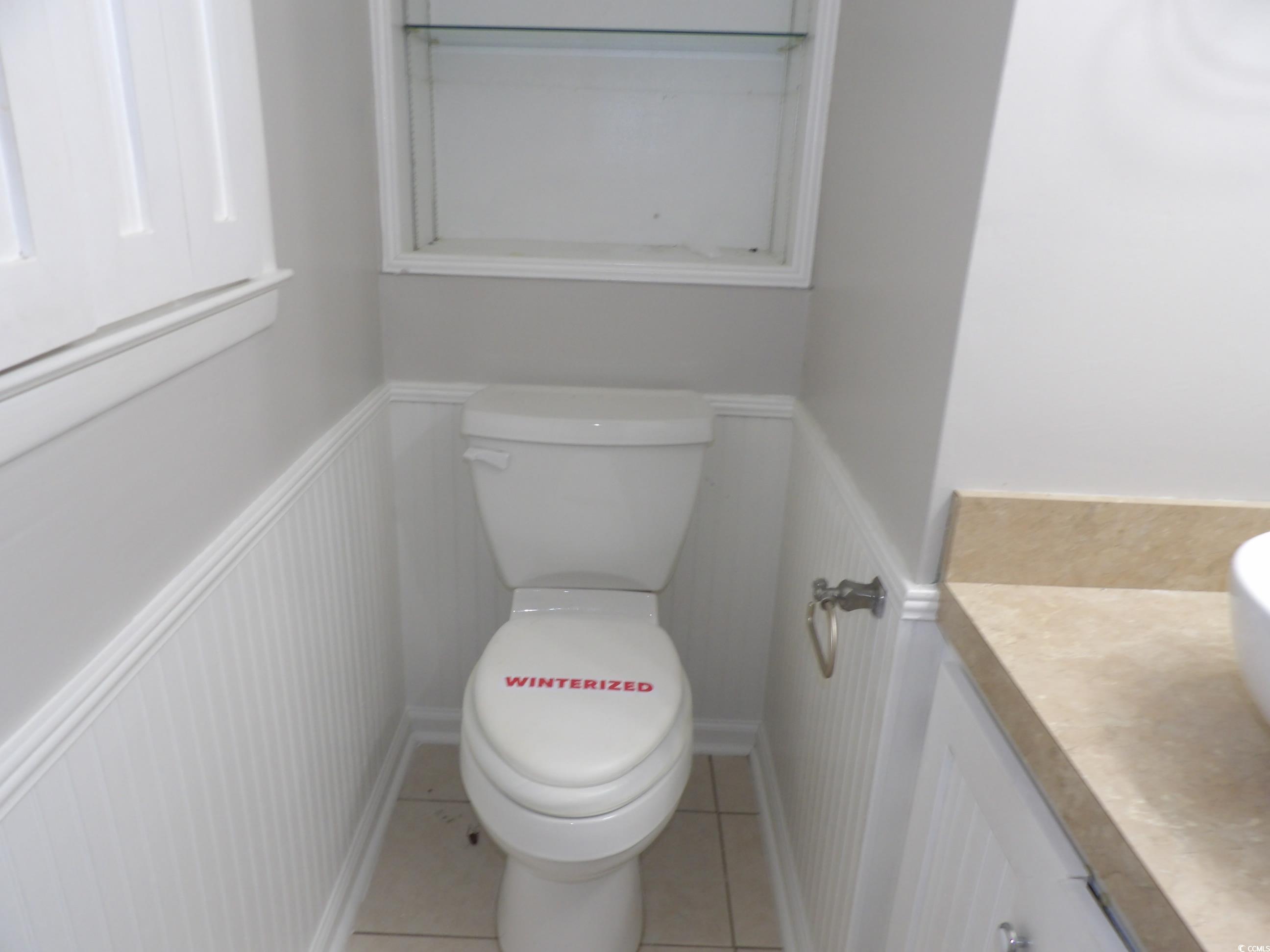 330 Stanley Drive Murrells Inlet, SC 29576 - Photo 19 of 32 Bathroom featuring vanity, toilet, and tile patter