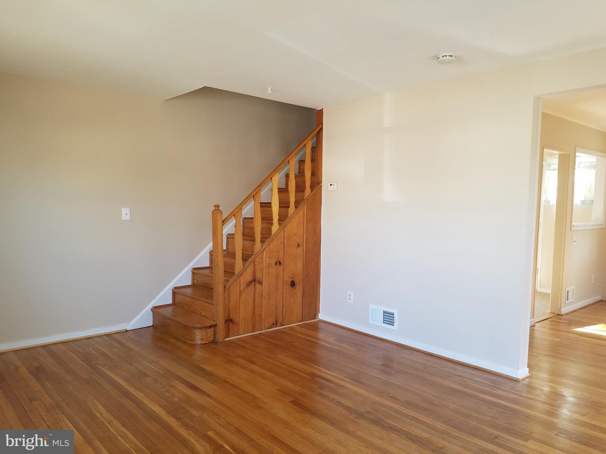 12021 Centerhill Street Silver Spring, MD 20902 - Photo 3 of 19 Living Room stairs to upper level