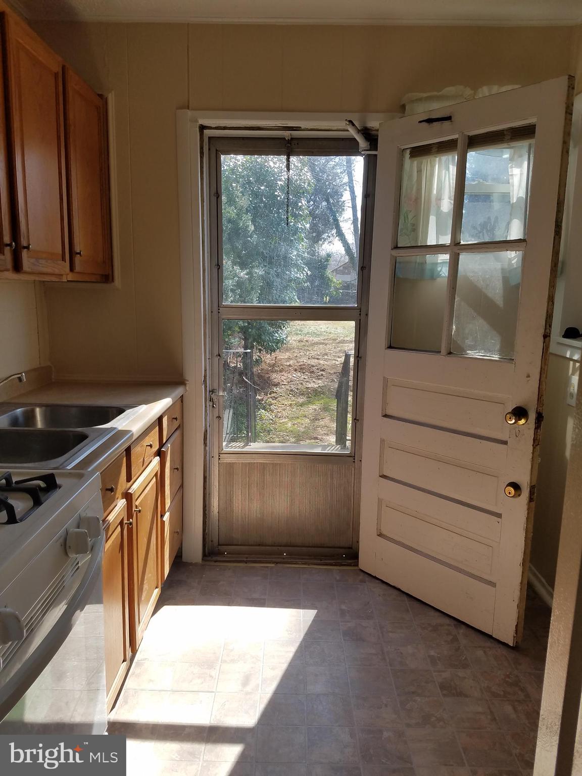 12021 Centerhill Street Silver Spring, MD 20902 - Photo 8 of 19 Kitchen access to back porch/yard