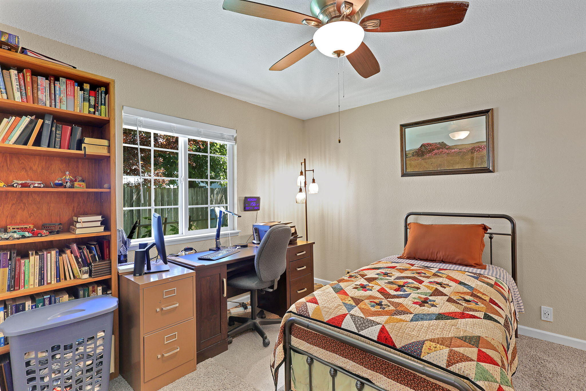 7022 Marvin Trail Redding, CA 96001 - Photo 14 of 27 a bedroom with furniture and a book shelf