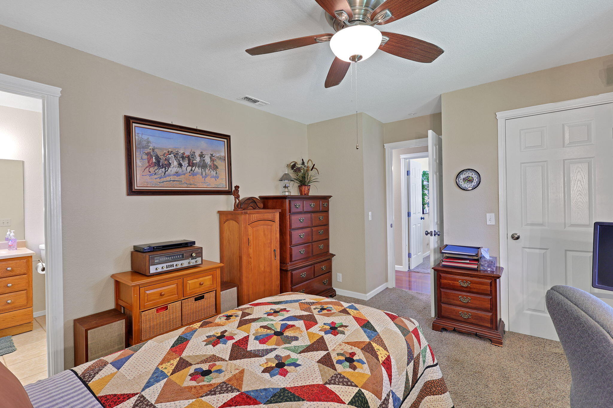7022 Marvin Trail Redding, CA 96001 - Photo 15 of 27 a bedroom with a bed and a chandelier