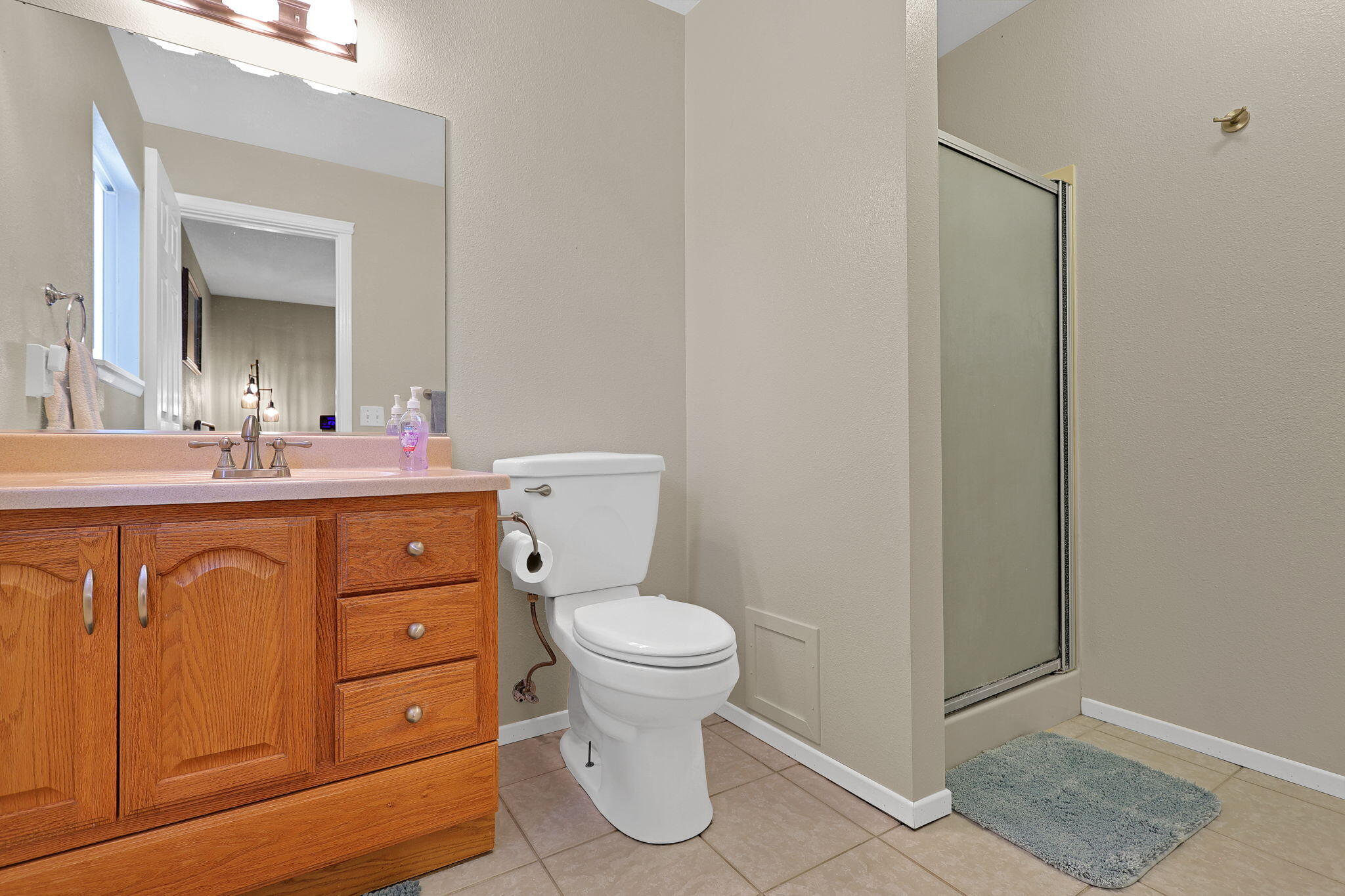 7022 Marvin Trail Redding, CA 96001 - Photo 16 of 27 a bathroom with a toilet sink and mirror