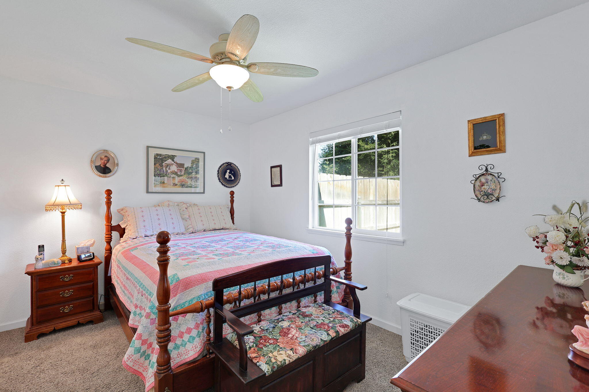 7022 Marvin Trail Redding, CA 96001 - Photo 17 of 27 a bedroom with a bed and a chandelier