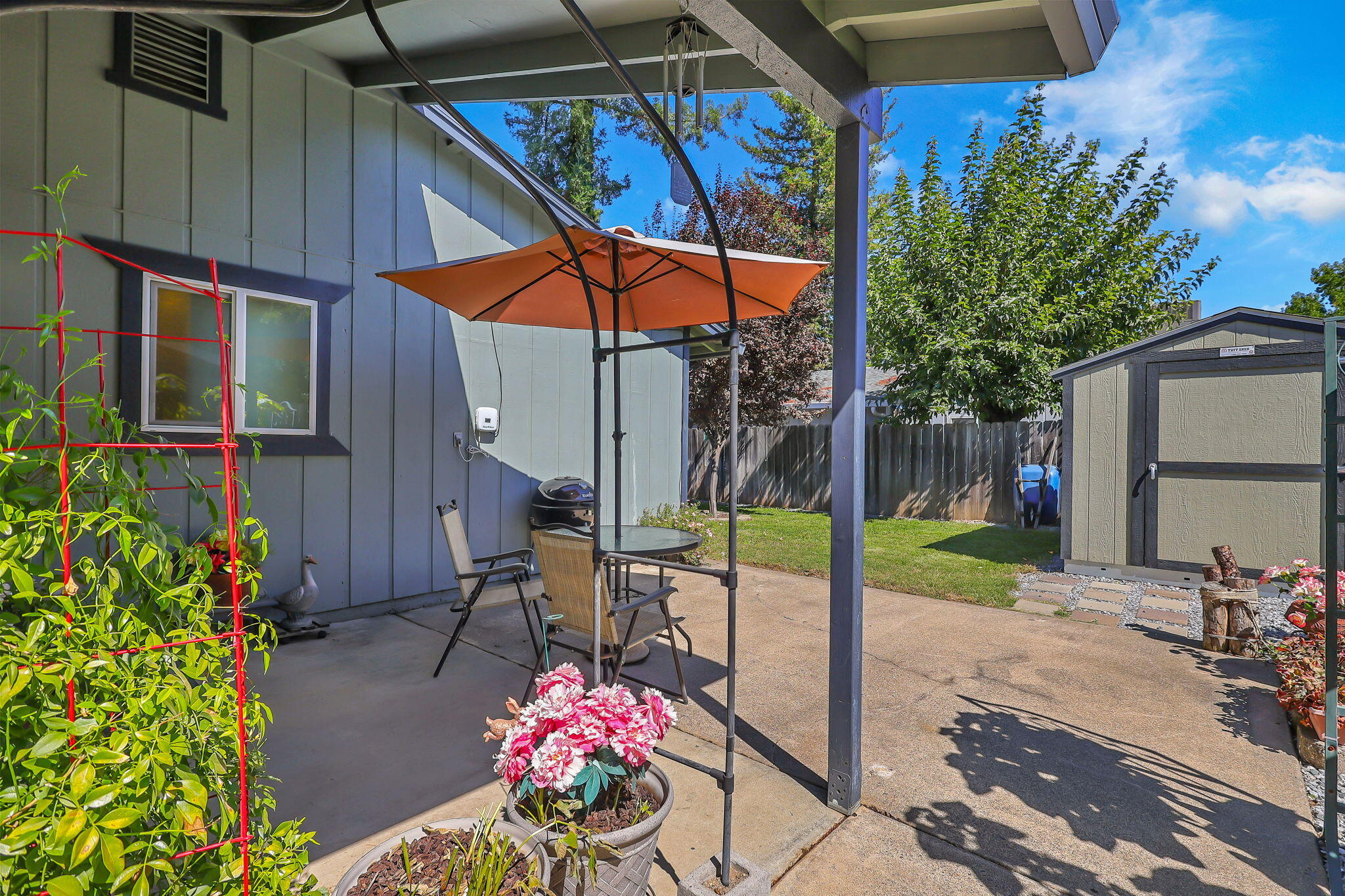 7022 Marvin Trail Redding, CA 96001 - Photo 23 of 27 a view of a backyard with sitting area