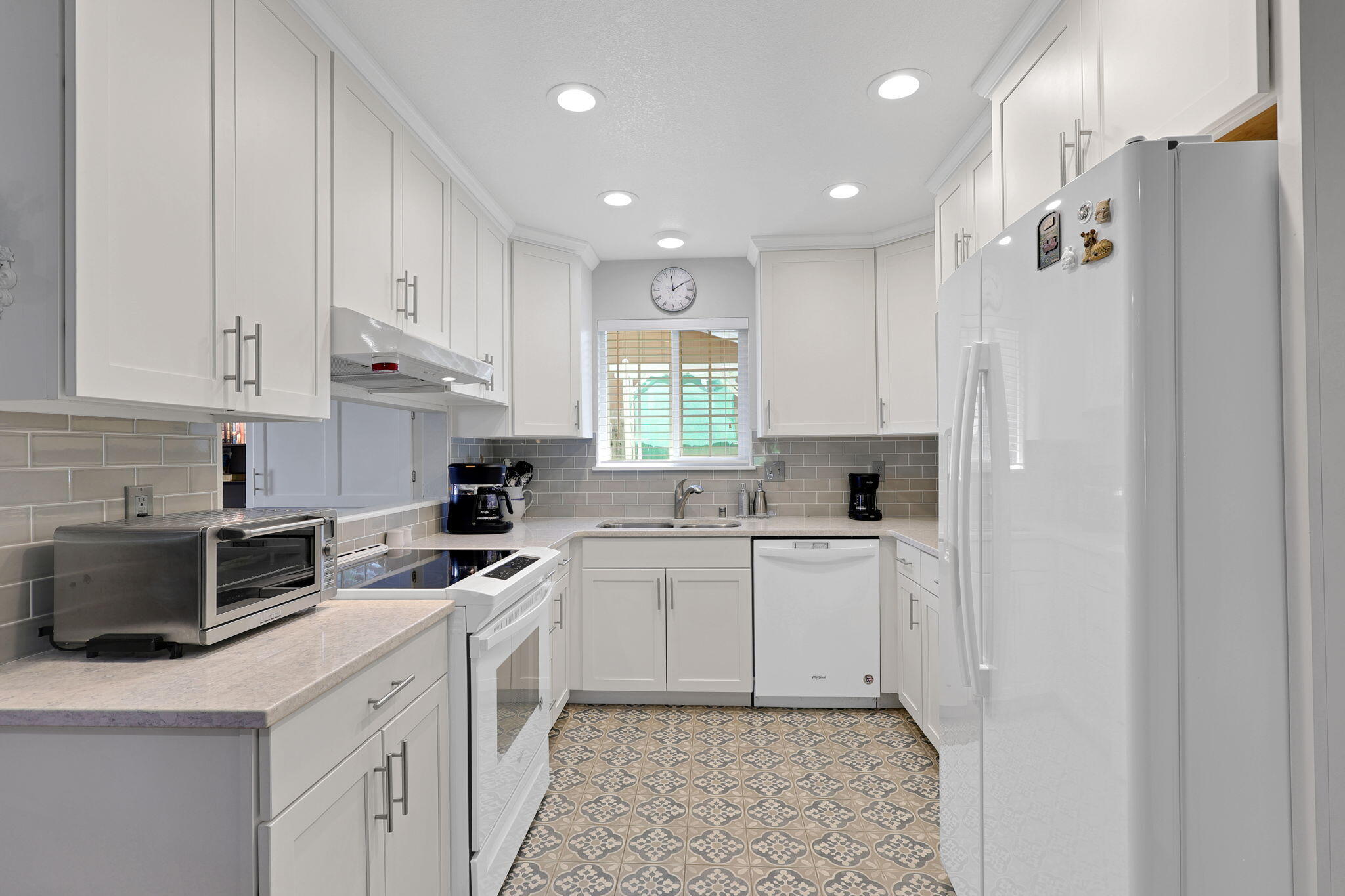 7022 Marvin Trail Redding, CA 96001 - Photo 7 of 27 a kitchen with white cabinets and white appliances