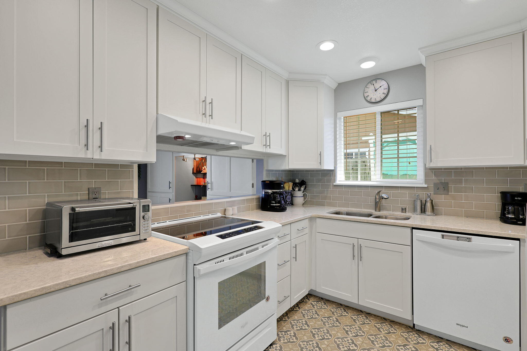7022 Marvin Trail Redding, CA 96001 - Photo 8 of 27 a kitchen with cabinets appliances a sink and a window