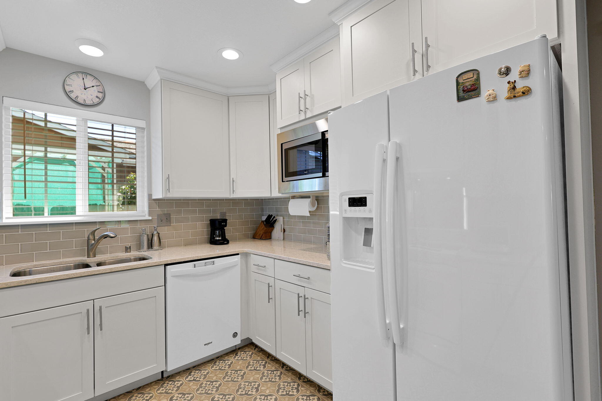 7022 Marvin Trail Redding, CA 96001 - Photo 9 of 27 a kitchen with white cabinets and window