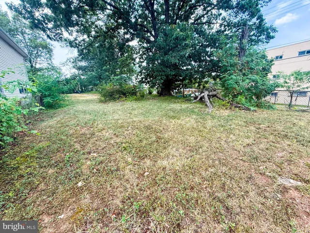 a view of yard with swimming pool
