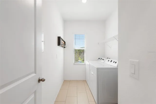 a bathroom with a bathtub sink and mirror