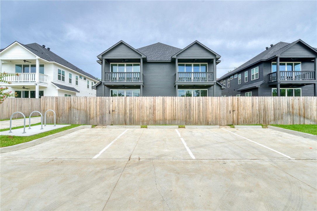 305 Cooner Street, Unit A College Station, TX 77840 - Photo 4 of 35 front view of a house with a yard and wooden fence