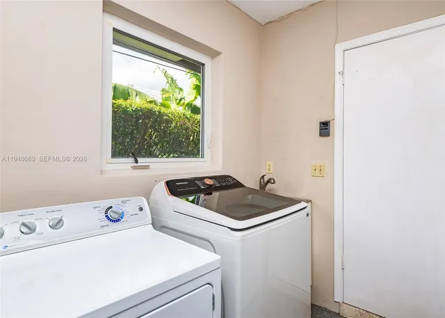 a kitchen with a stove and a window