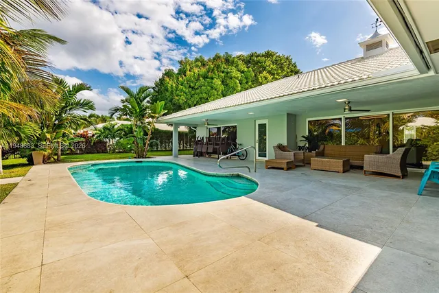 a view of a swimming pool with a patio