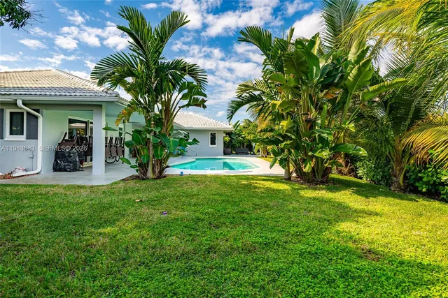 a view of a house with a swimming pool