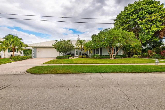 a front view of a house and a yard
