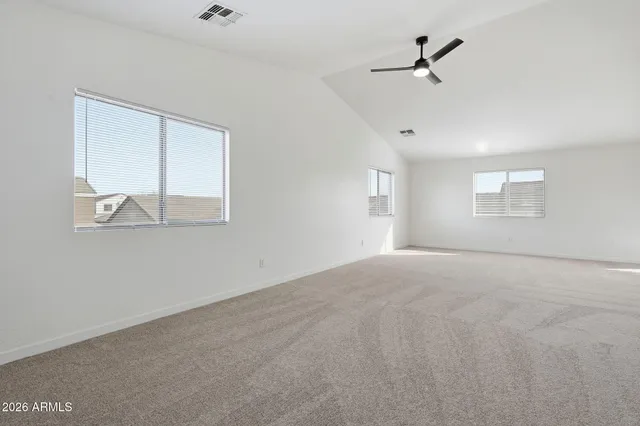 a view of empty room with windows