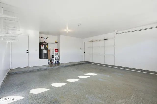 a view of a house with a backyard and a garage