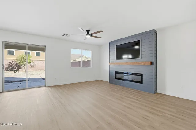 a view of livingroom with furniture flat screen tv and window