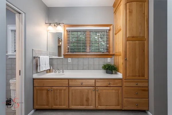 a bathroom with a sink and a mirror