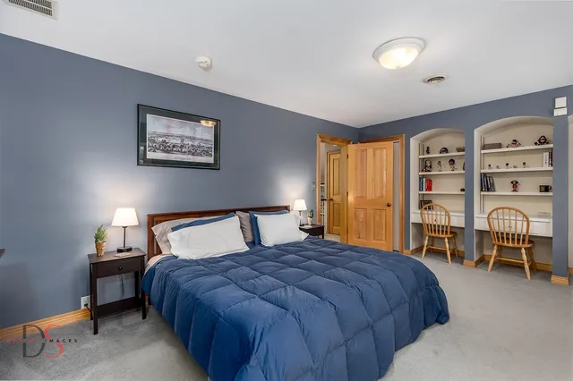 a view of a kitchen with wooden floor and electronic appliances