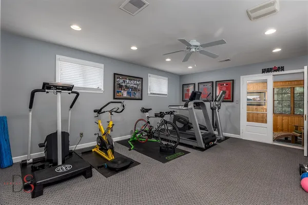 a room with furniture pool table and window