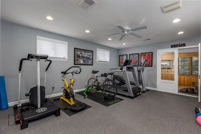 a room with furniture pool table and window
