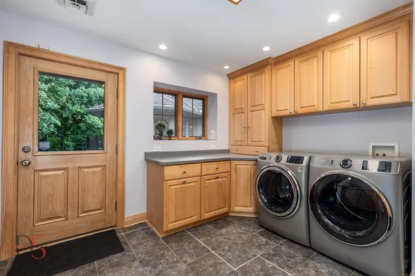 a front view of a house with swimming pool having outdoor seating
