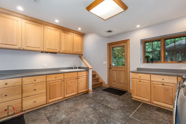 a view of a patio with couple of chairs and a patio
