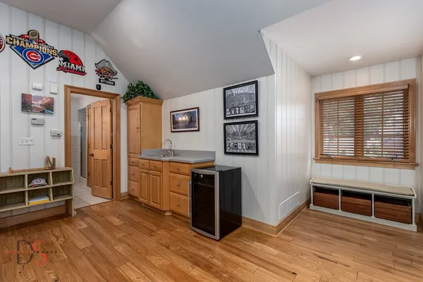 a front view of a house with a yard table and chairs