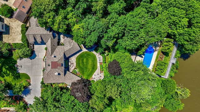 a backyard of a house with lots of green space and garden