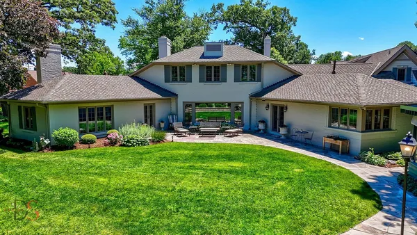 a view of balcony with wooden floor and outdoor seating
