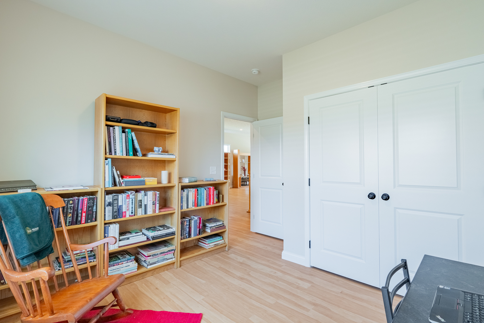 1906 Dunraven Road Bloomington, IL 61704 - Photo 12 of 28 a room with furniture and a book shelf