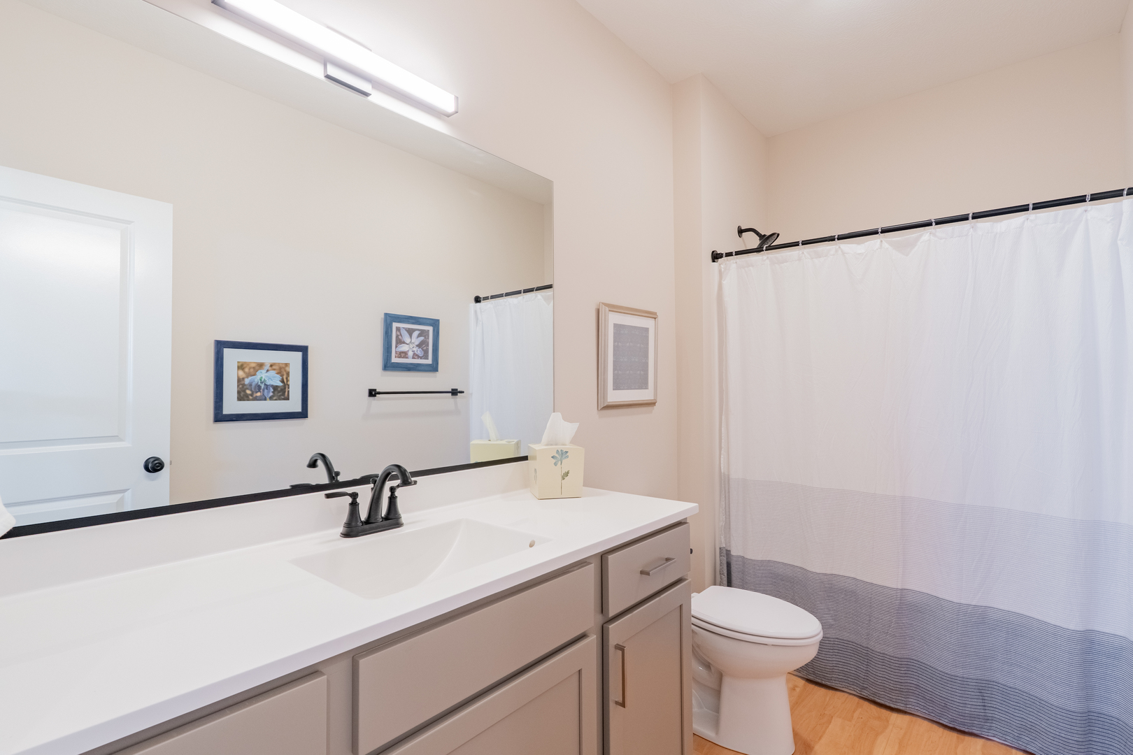 1906 Dunraven Road Bloomington, IL 61704 - Photo 13 of 28 a bathroom with a sink toilet a mirror and shower