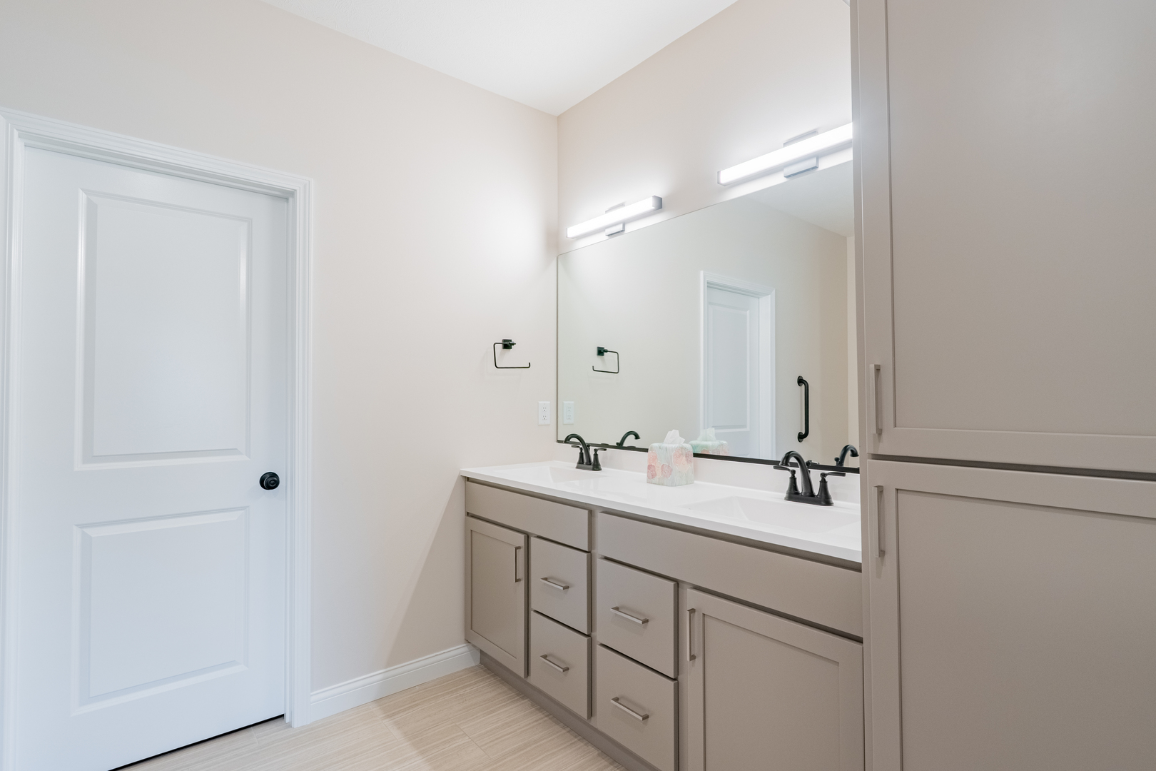 1906 Dunraven Road Bloomington, IL 61704 - Photo 16 of 28 a bathroom with a double vanity sink and mirror