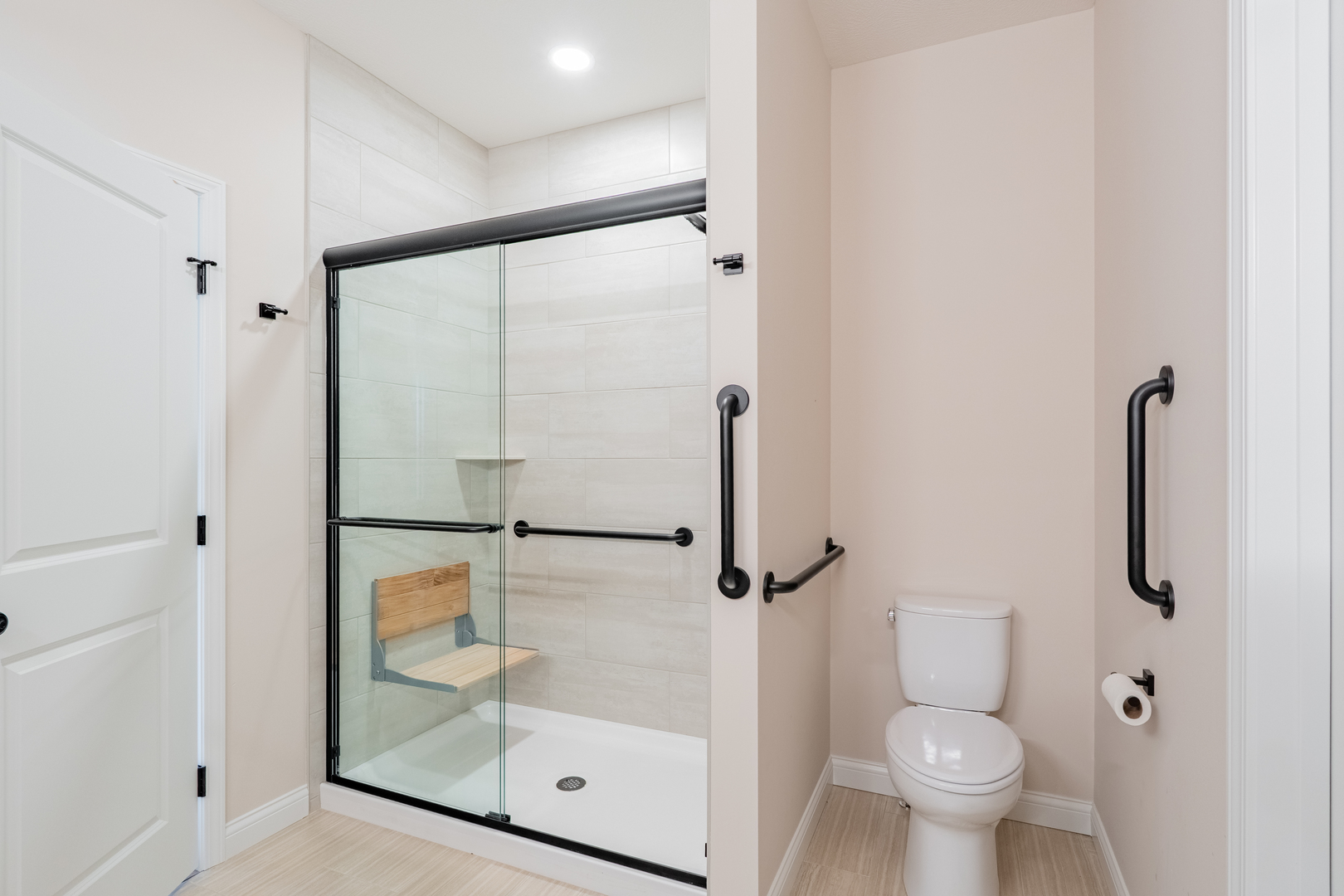 1906 Dunraven Road Bloomington, IL 61704 - Photo 17 of 28 a bathroom with a glass shower door