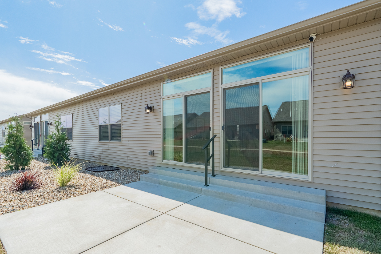 1906 Dunraven Road Bloomington, IL 61704 - Photo 24 of 28 a front view of a house with a garden