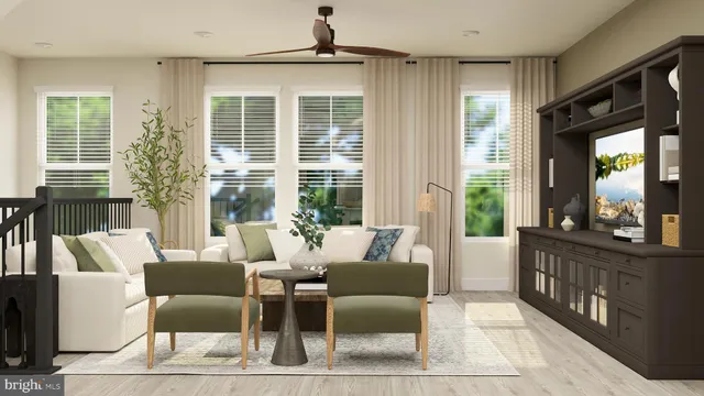 a living room with furniture and large windows