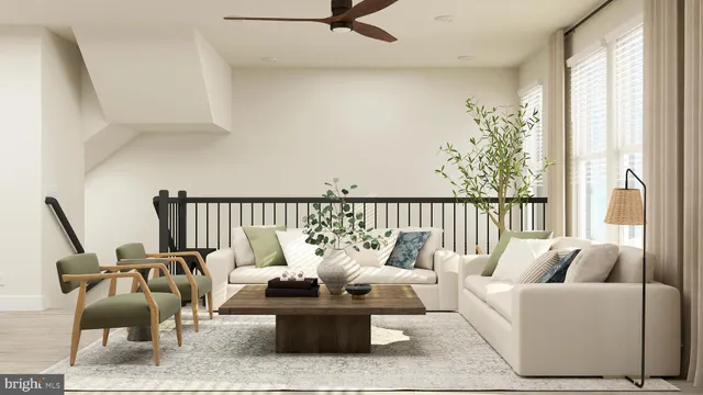 a living room with furniture and floor to ceiling windows