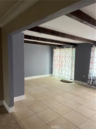 a view of an empty room with a fireplace