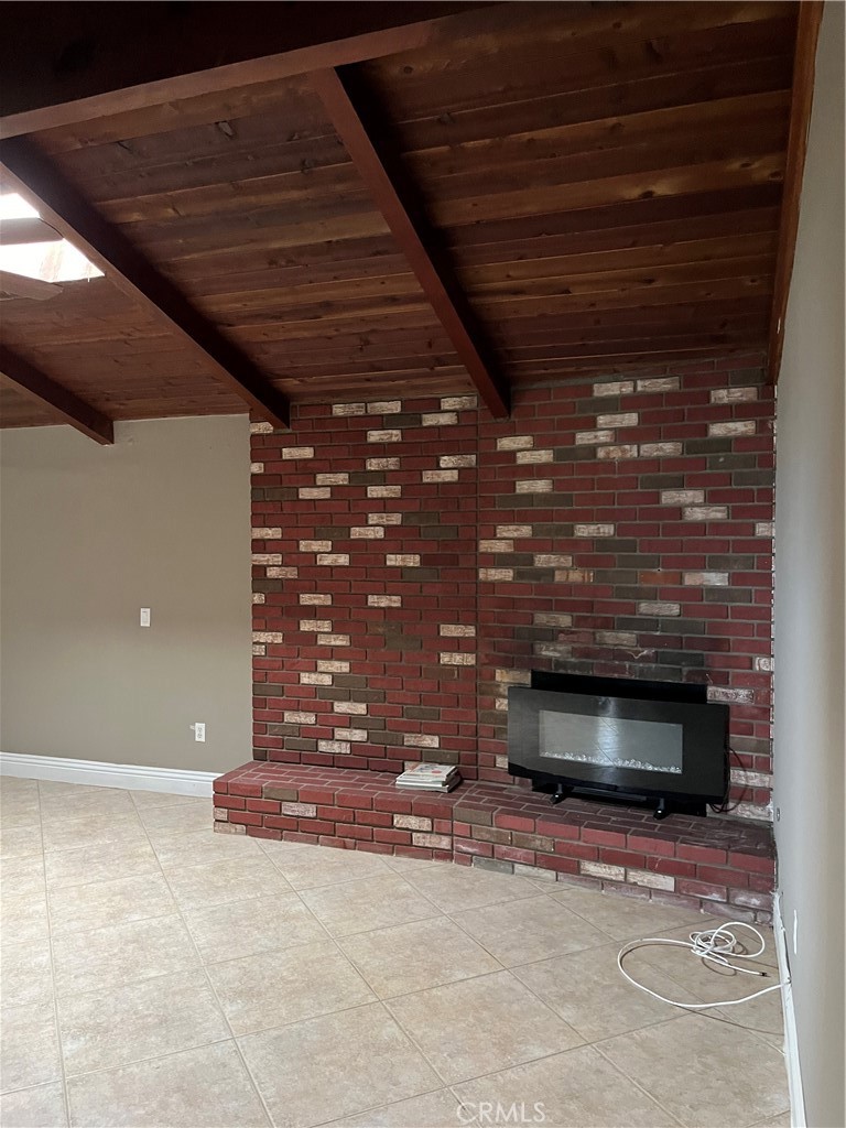 19260 Santa Rosa Mine Road Perris, CA 92570 - Photo 21 of 22 a view of an empty room with a fireplace