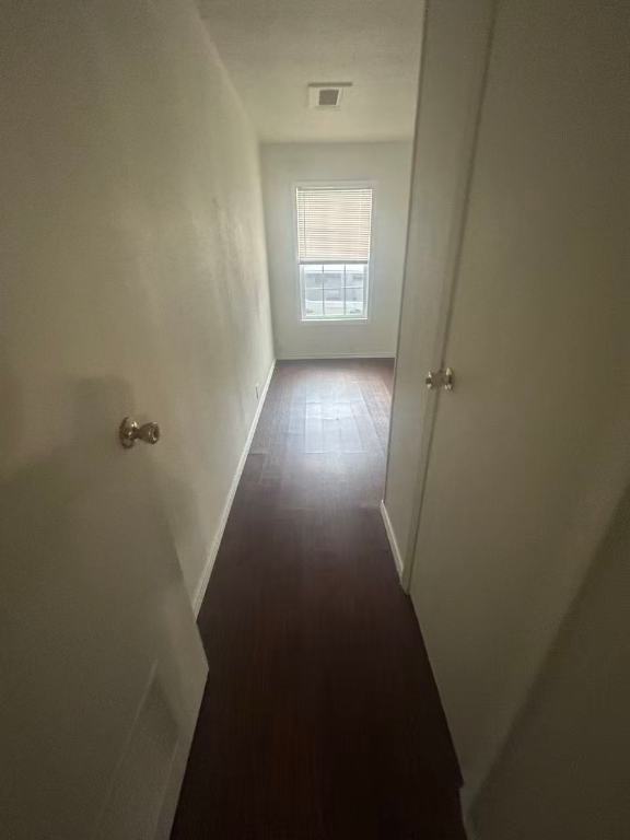 23393 Nameless Road, Unit 123 Leander, TX 78641 - Photo 11 of 15 a view of a hallway with wooden floor and closet