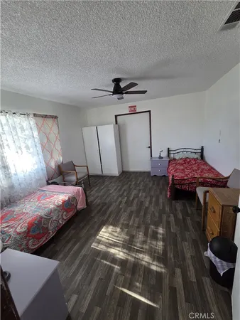 a bedroom with bed and window