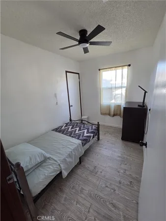 a bedroom with furniture and a window