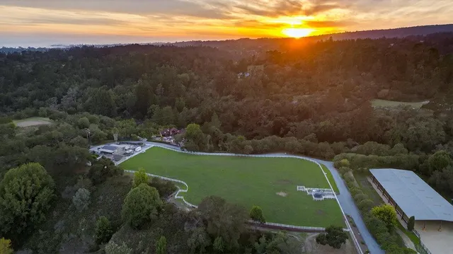 an aerial view of a house with a garden