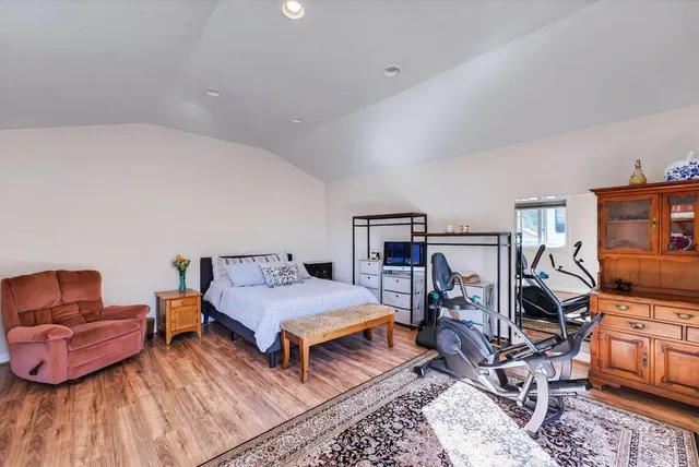 a view of a garden with a building in the background